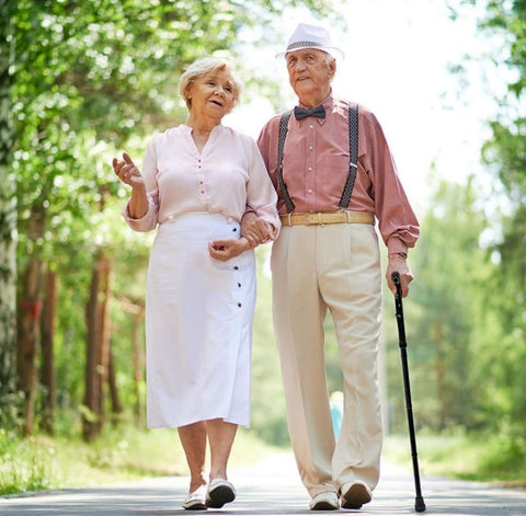 Adults walking with the Vaunn Medical cane