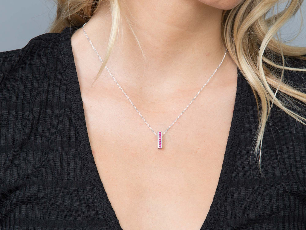 A pink tourmaline Heart pendant necklace on a model