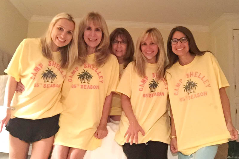 Girls and women with custom t-shirts "camp shellley 65th season"