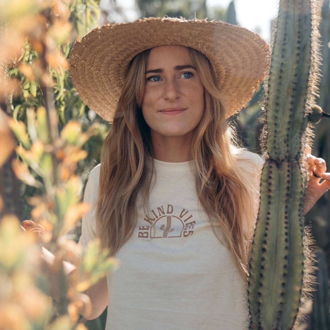 Hero image featuring the front of the Be Kind Vibes Desert Waves crop top in natural