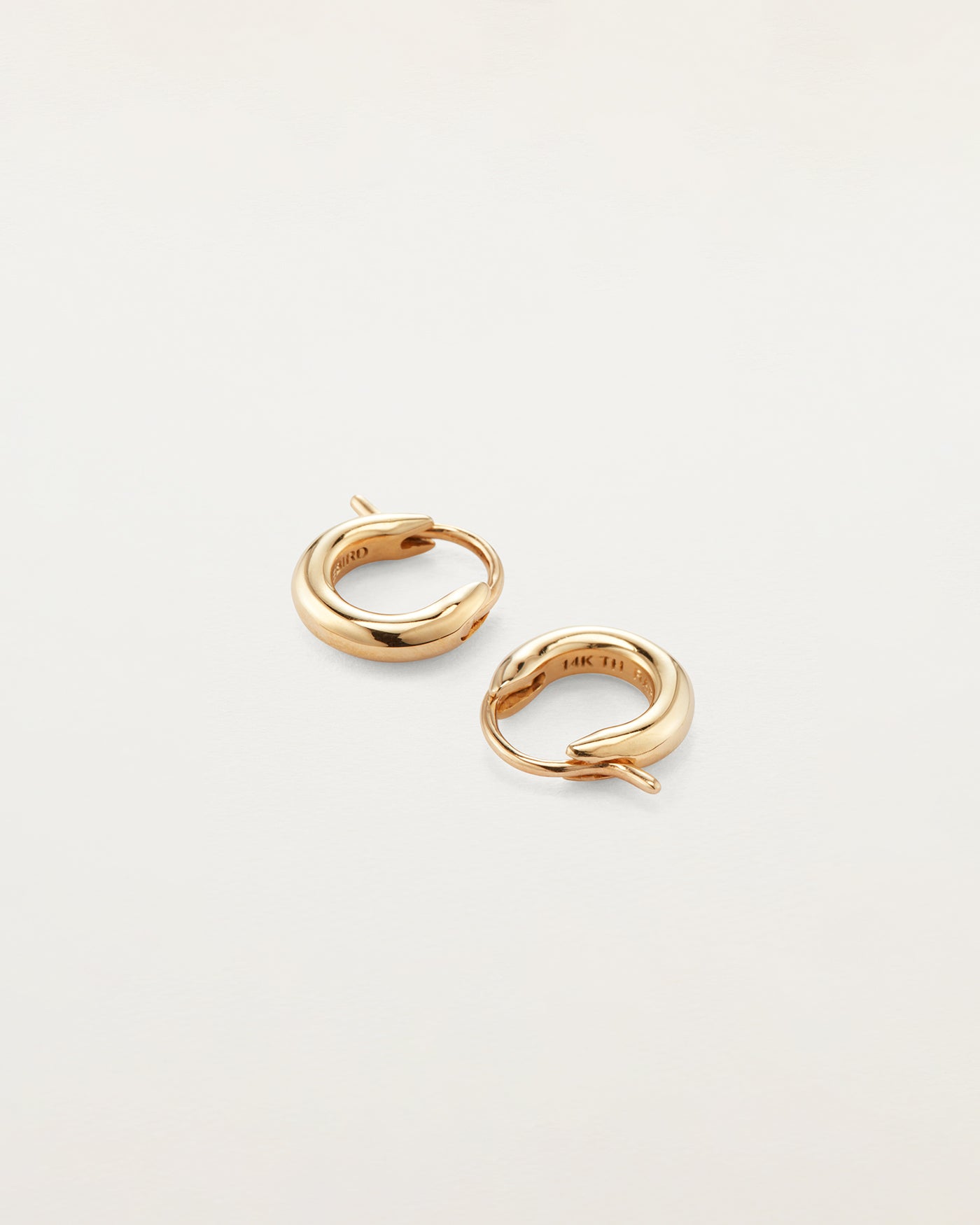 Adorna 14K White Gold Huggie Hoop Earrings: Timeless Elegance - 1/2