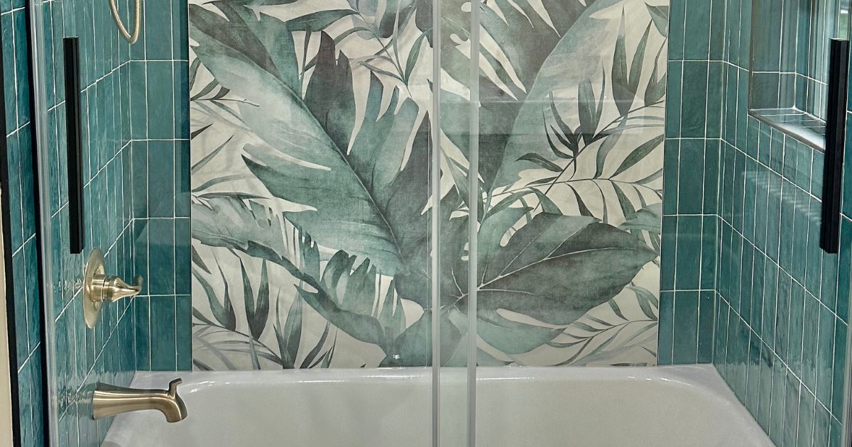 shower with tropical mural tile and subway tile