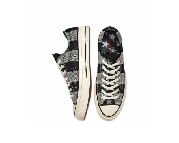 white low top converse with black stripe