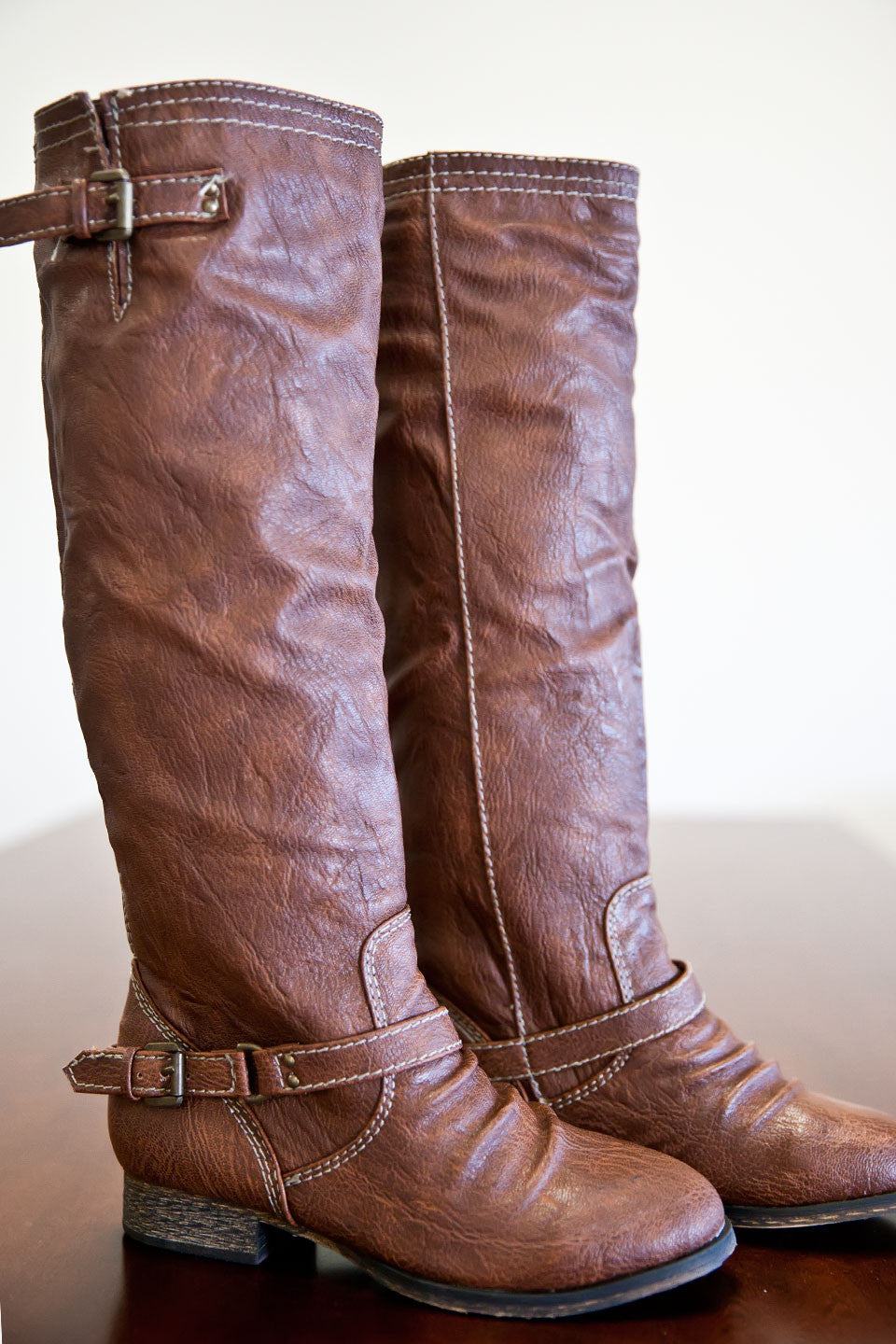 riding boots with red zipper