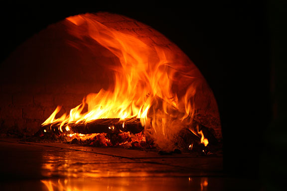 fire inside a pizza oven