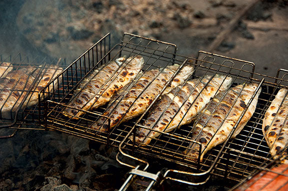 whole cooked fish in grilling rack