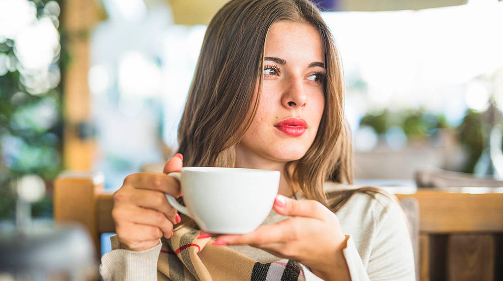 Woman drinking matcha