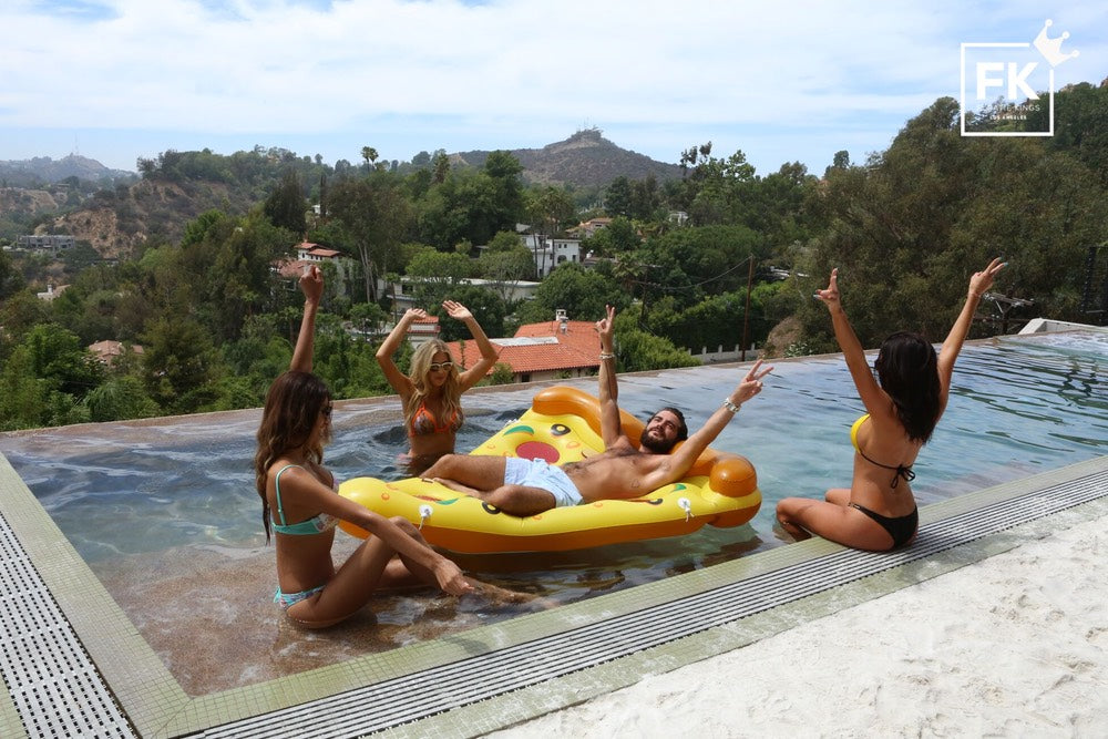 girl pool party with a pizza floatie 