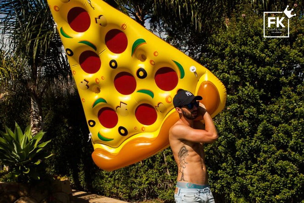 man with a pizza floatie