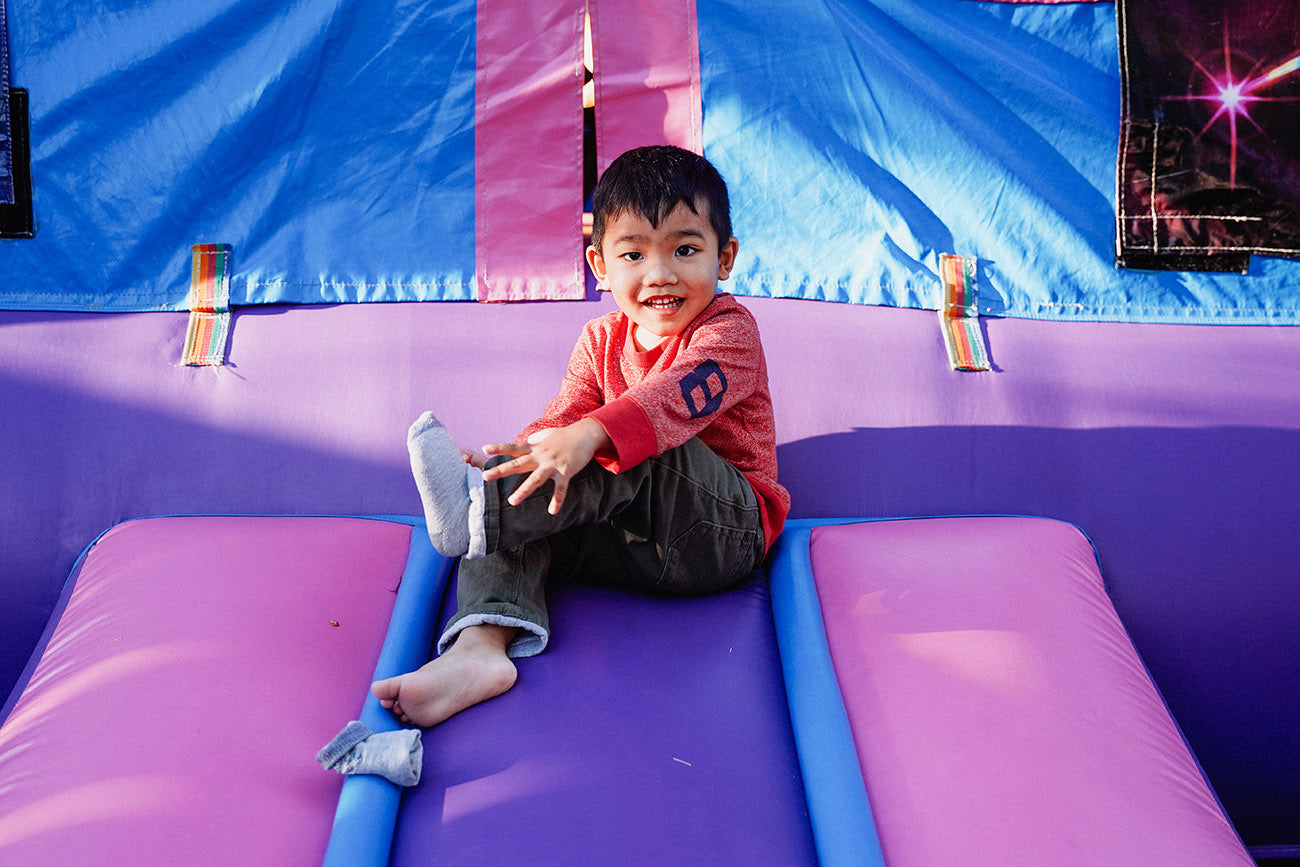 kid playing in a bounce house