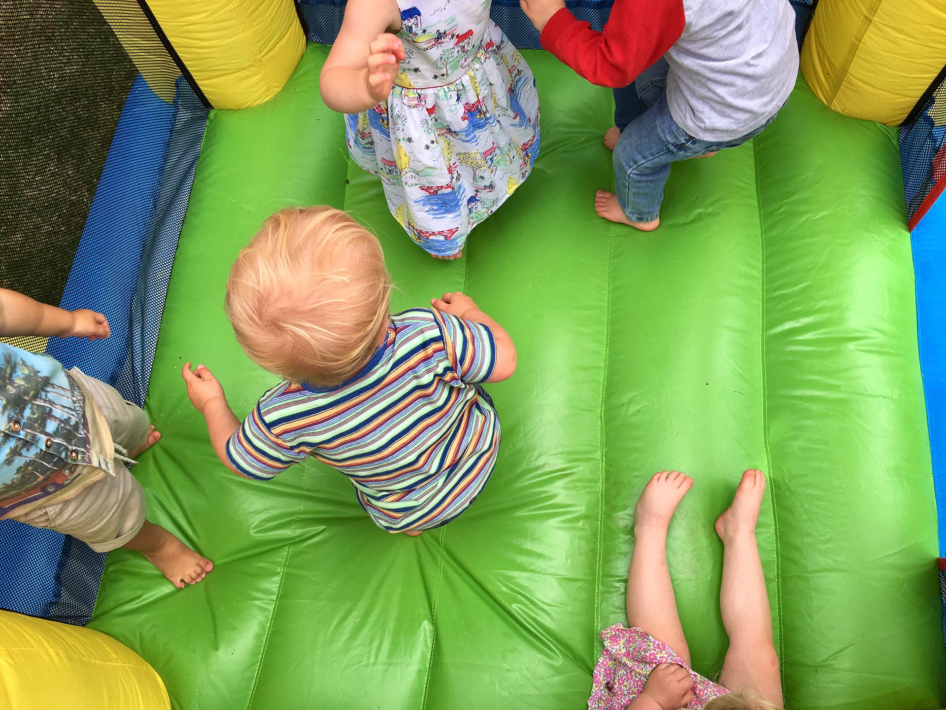 kids in a big inflatable bounce house