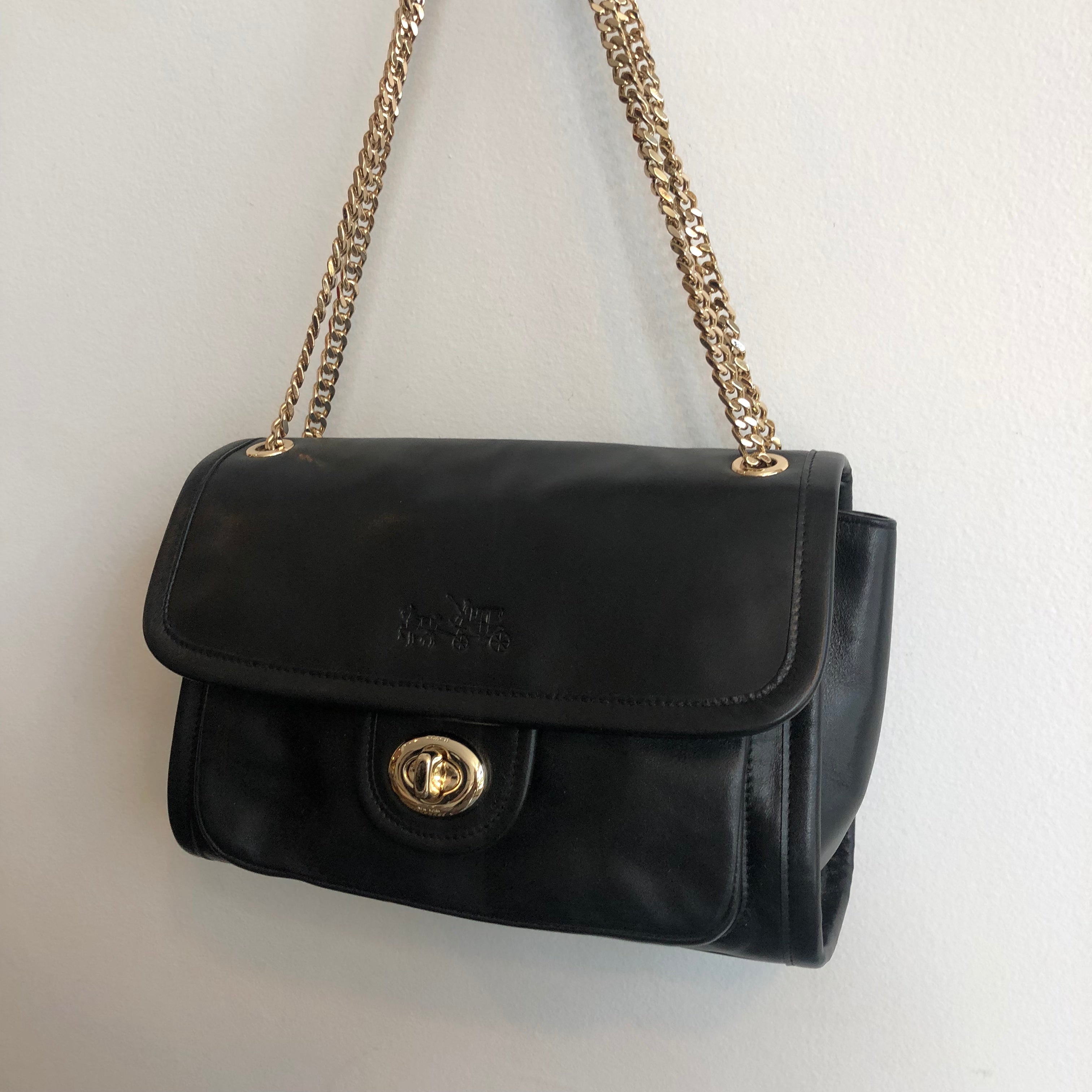 black coach purse with gold chain