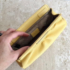 pastel yellow clutch bag