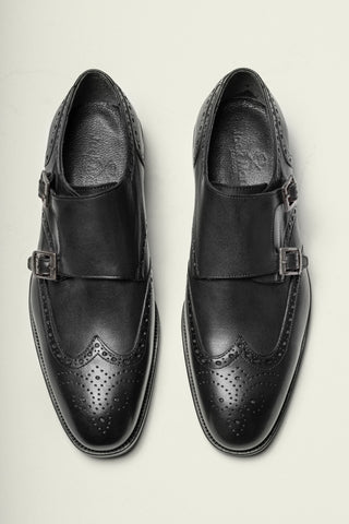 When wearing a black suit, shoes are essential to the outfit