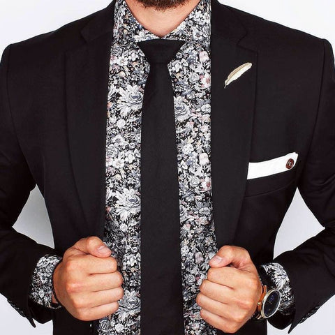 When pairing a printed shirt with a black suit, it's essential to consider the event's formality.