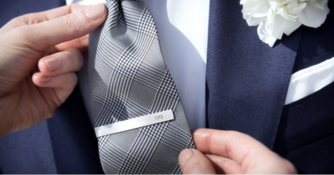 Tie clip attaches to the front of the tie, letting you securely fasten the tie at your neck