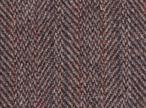 Tweed is a durable and coarse woolen fabric that originated in Scotland and is known for its distinctive, textured appearance