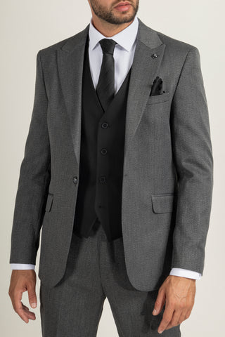 The best choice is none other than a black waistcoat with a grey suit