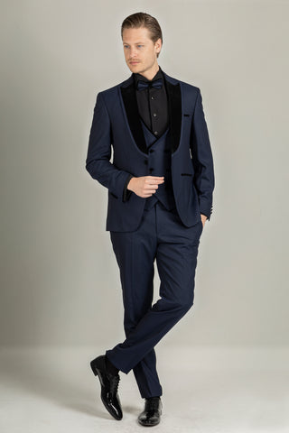 A navy suit gives a royal look, and when you match it with black shoes, it sharpens the elegance