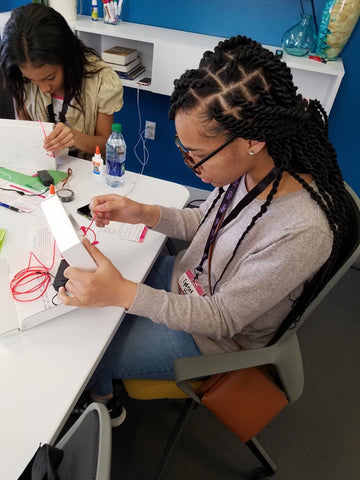 Girl building her Science Kit