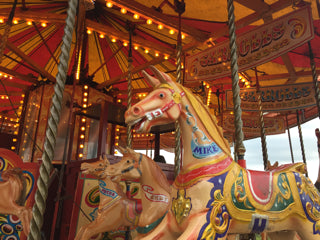 Merry go round horses at funfair