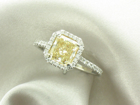 1.50 ct fancy yellow diamond surrounded by .35 ctw in white accent diamonds