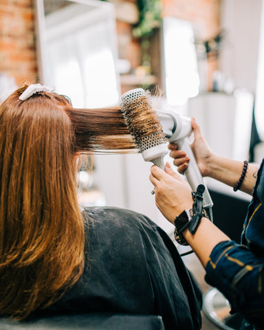 Hair being blow dryed