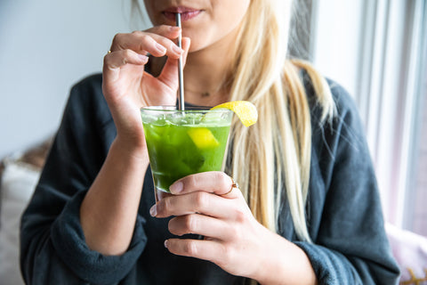 Girl drinking our Emerald Zen matcha iced tea