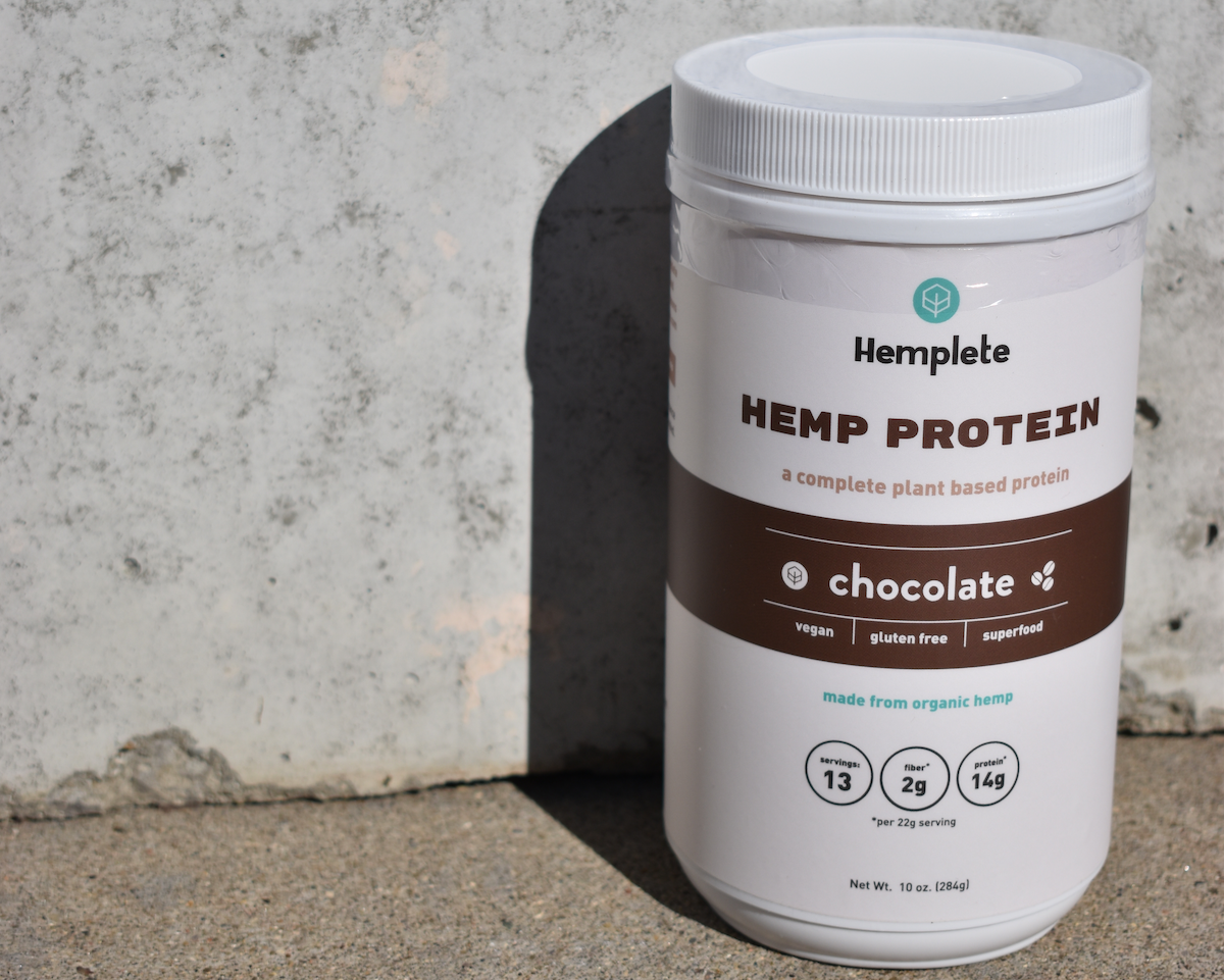 A chocolate hemp protein powder container