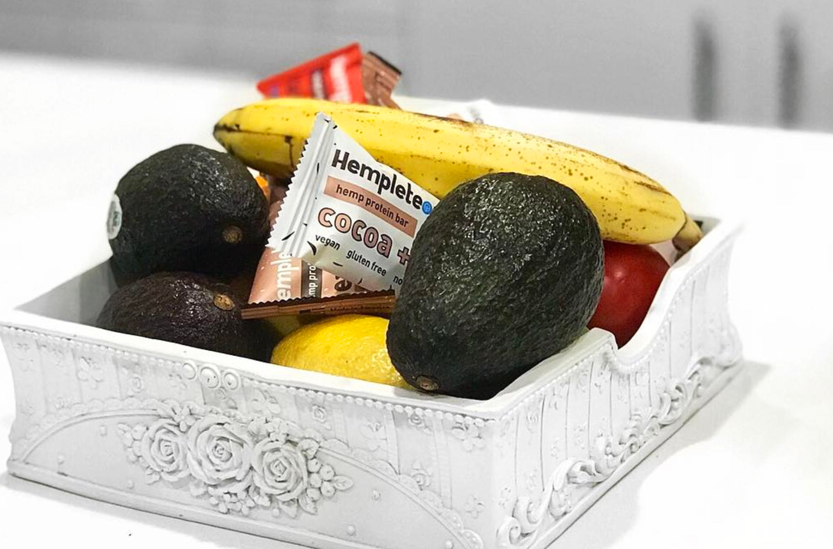 A box with energizing fruits, veggies, and nutrition bars.