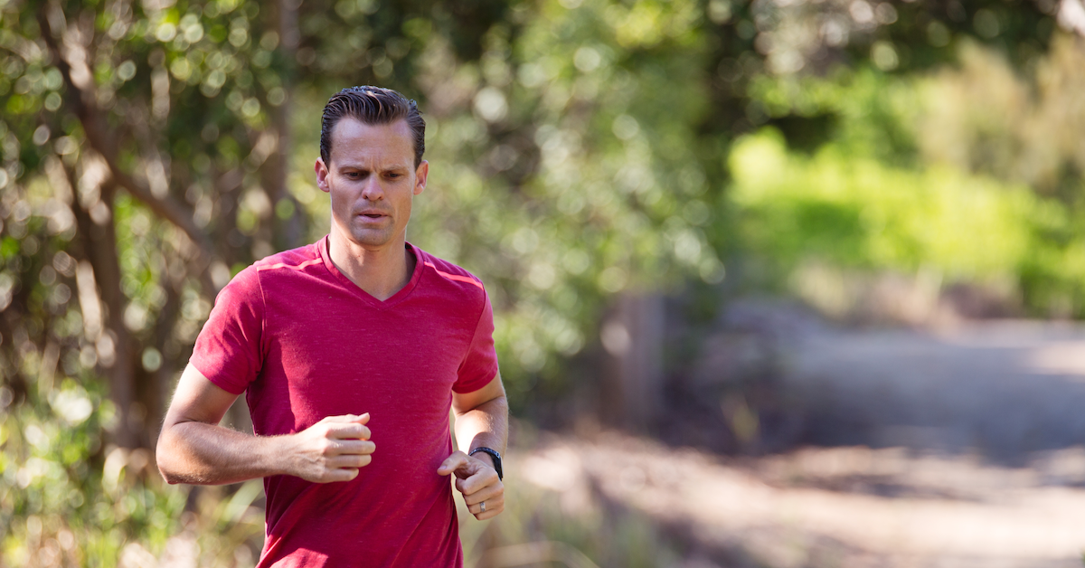 A man running on a trail 