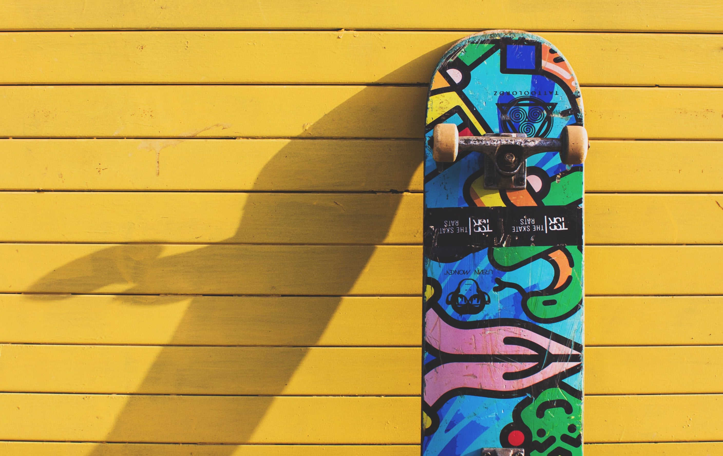 A hemp skateboard leaning against a wall
