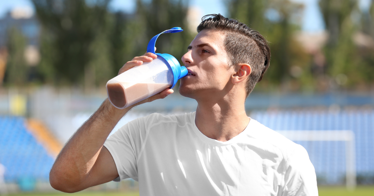 A man drinking a hemp protein shake
