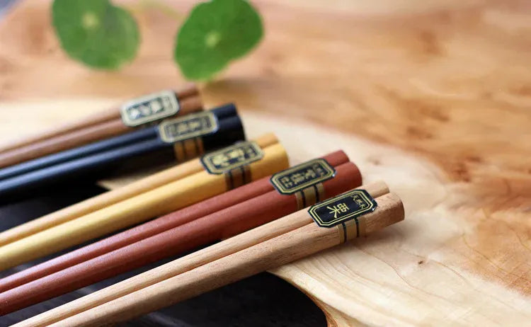 Wooden chopsticks on a wooden board