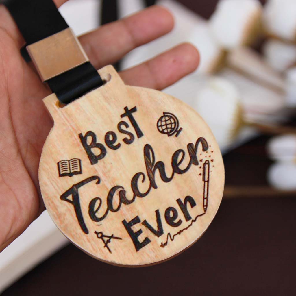 Best Teacher Ever Personalized Wooden Medal. Personalize this unique Best Teacher Ever custom medal with a teacher's name at the back of the medal. Looking for Teacher's Day gifts? This personalized wooden medal will make the perfect gift for your favorite teacher.