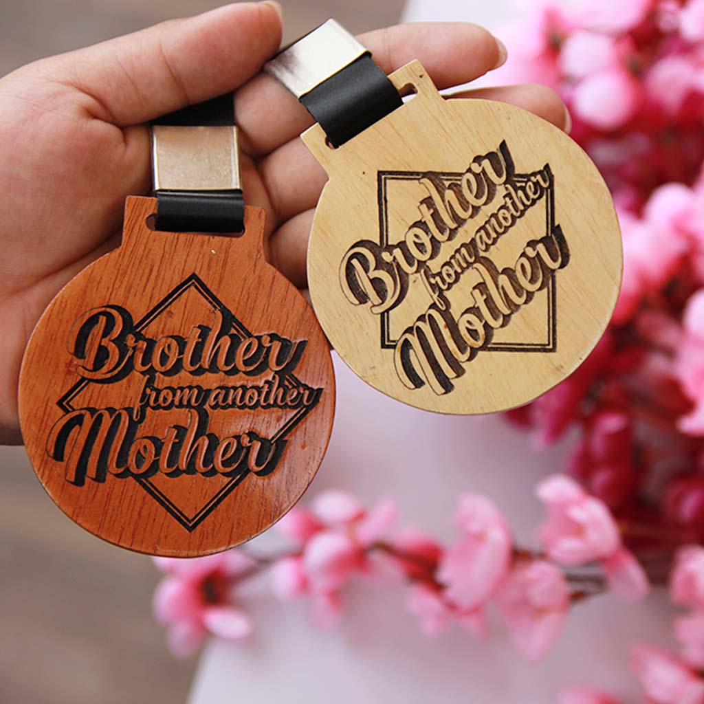 Brother From Another Mother Wood Carved Medal. This Unique Wooden Medal Makes A Great Gift For Raksha Bandhan. Buy More Rakhi Special Gifts Online From The Woodgeek Store.