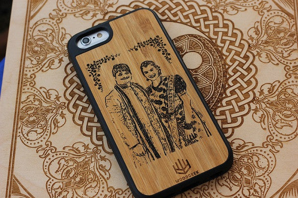 A wooden iPhone case engraved with a couple photo