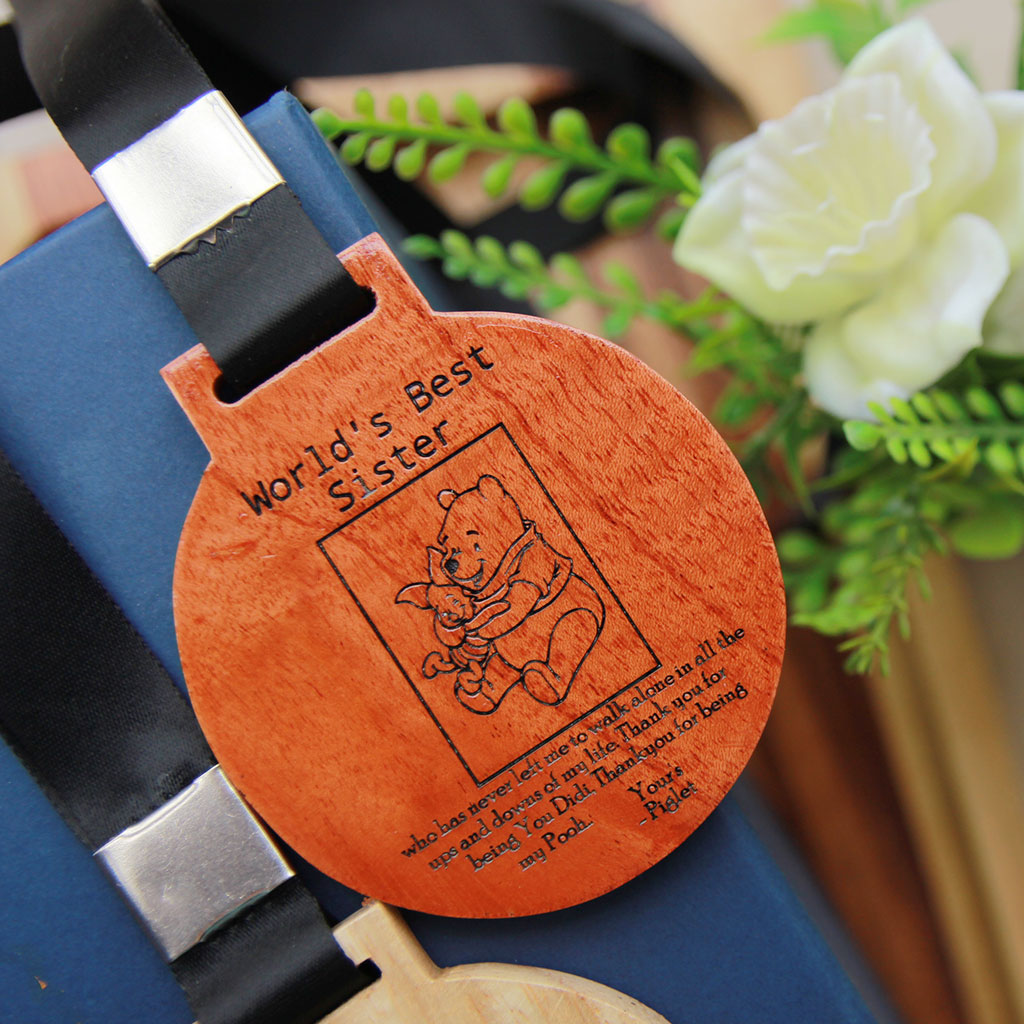 Customized Wooden Medal For The World's Best Sister. These Award Medals Make The Best Gift Ideas For Sisters. Buy More Custom Engraved Wooden Gifts For Sister Online From The Woodgeek Store.