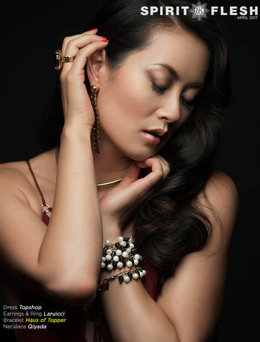 Actress Olivia Cheng wearing Haus of Topper pearl and pyramid necklace as bracelet.