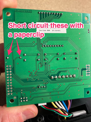 Fleck 5600SXT circuit board showing the solder pins for the battery