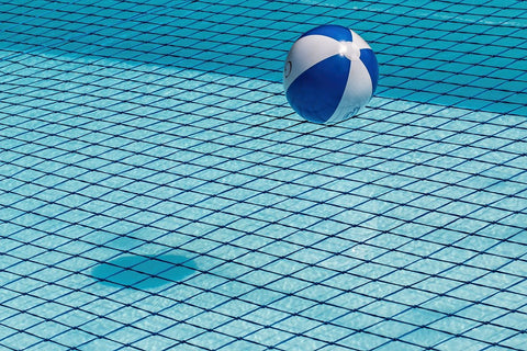 blue and white ball floating on pool