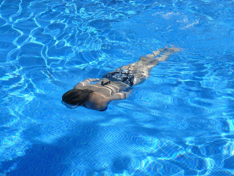 floating woman on pool