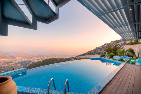 pool overlooking town while sun is up