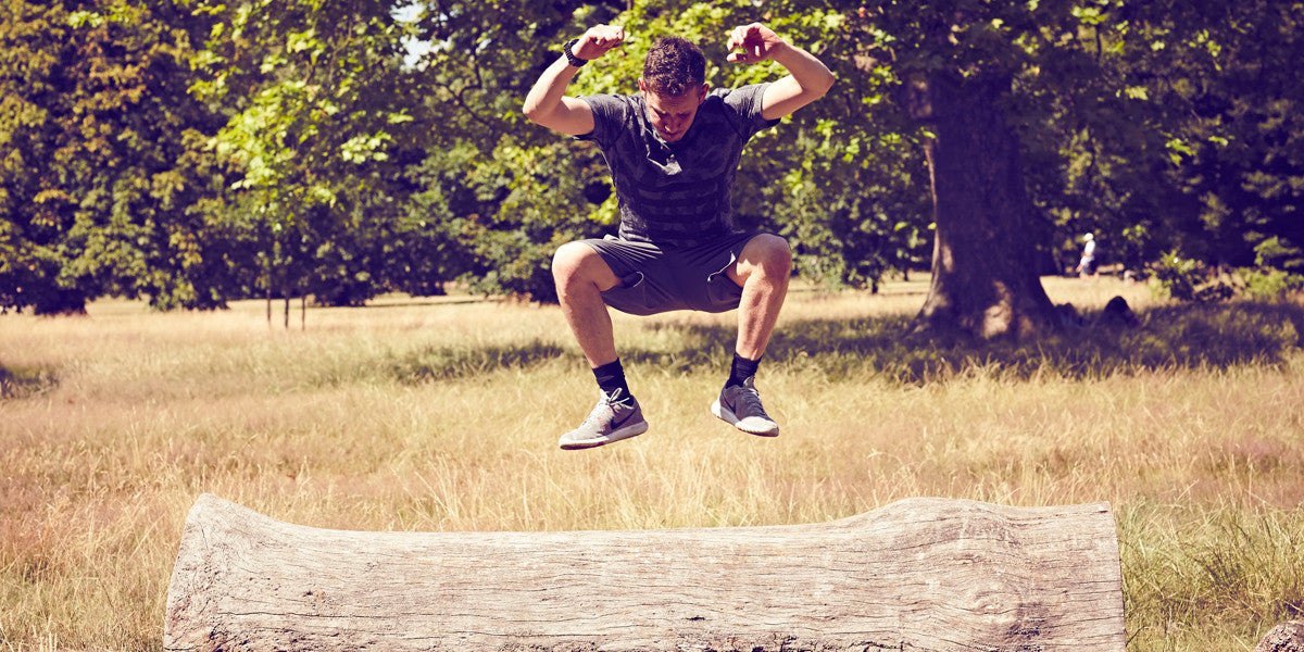 Personal Trainer Jumping Outdoors Workout