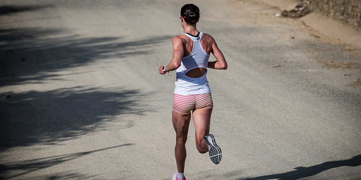 Woman Running Road Music Shorts liivi Trainers