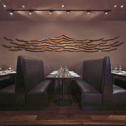 biophilic art made of floating wood pieces by Susie Frazier for a restaurant in Montana