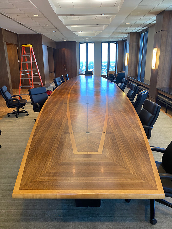 The client's former board room table was transformed into sections featured in the biophilic art titled, "FLOW," by Susie Frazier