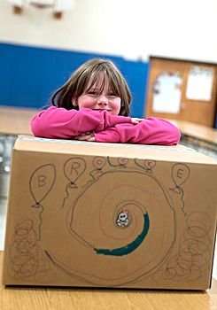 Girl with birthday party in a box