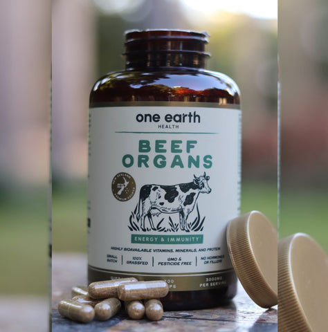 Beef organ supplement bottle by One Earth Health with liver, heart, kidneys, spleen, and pancreas from grass-fed New Zealand beef