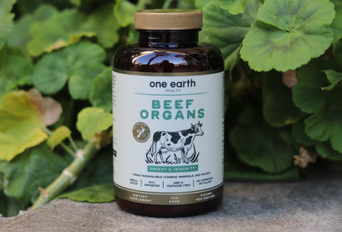 Beef organs supplement bottle, plants in the background—What is regenerative farming?